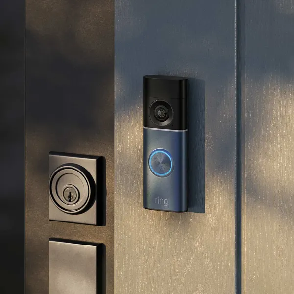 Ring video doorbell mounted beside a home entrance
