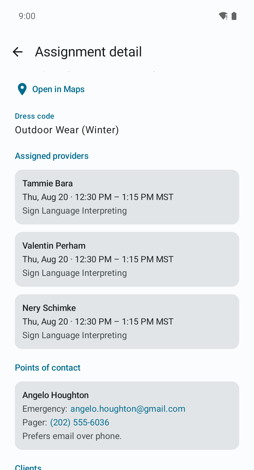 Lower half of the assignment detail screen with the dress code, three assigned providers, and a point of contact whose email address and phone number are tappable links.