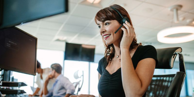 Smiling customer support representative with headset